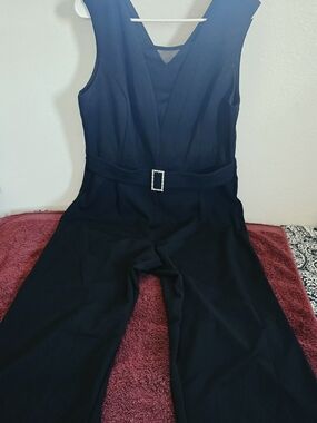 Sleek Black Sleeveless Jumpsuit with Rhinestone Buckle